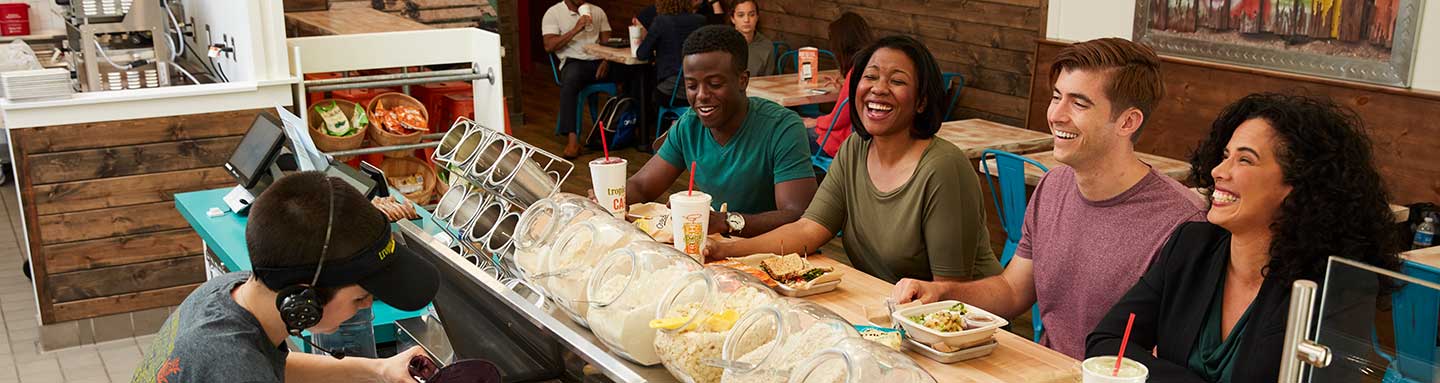 People sitting at a table, laughing